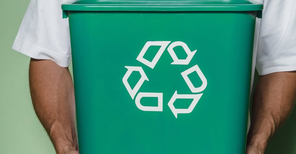Adult male holding a green recycling bin against a green background, promoting sustainability.